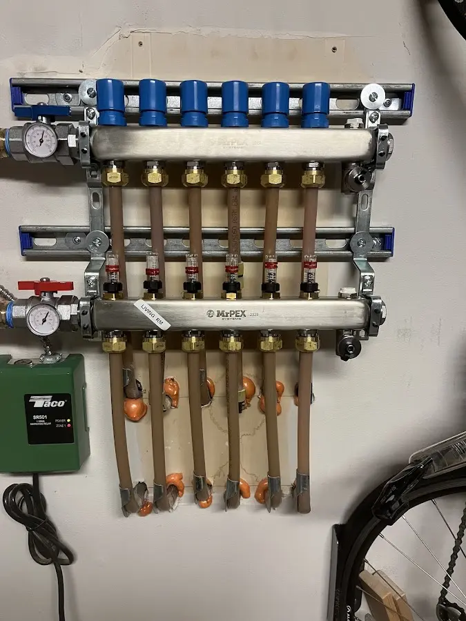 Plumber performing Water Heater Repair at a residential property in Neenah